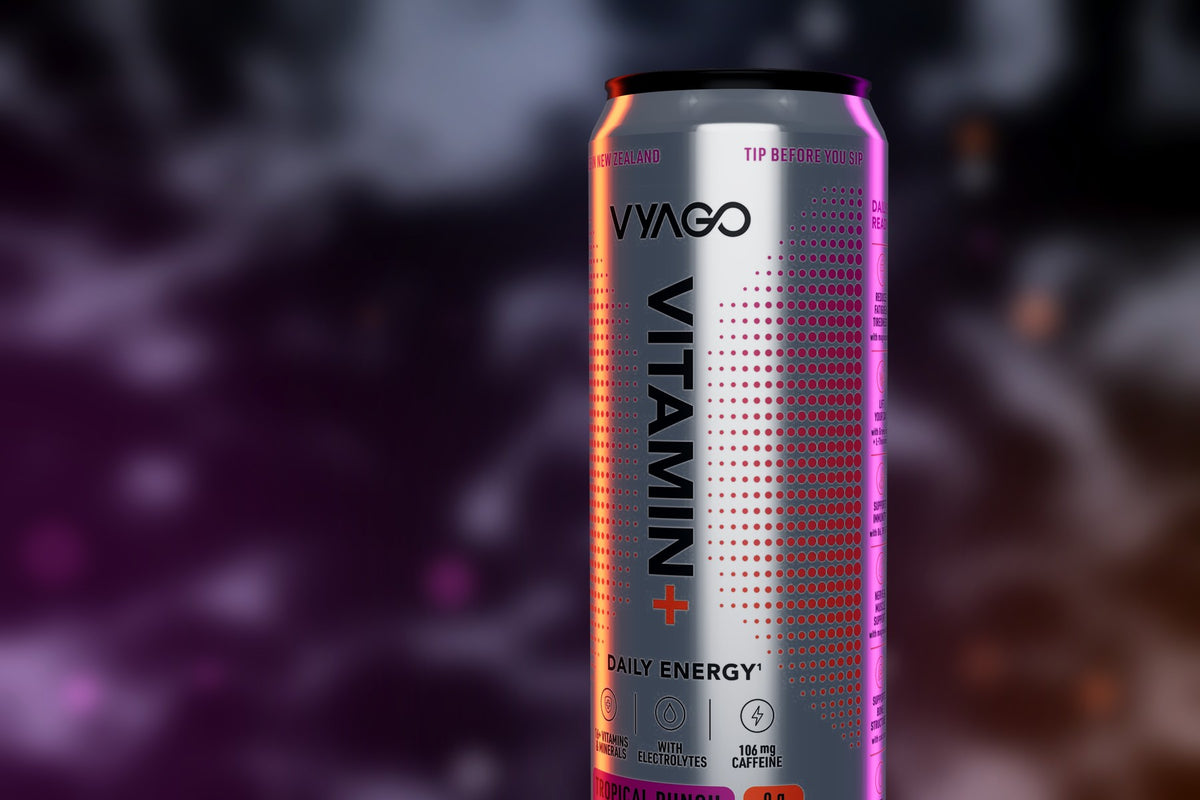 Close-up of a VYAGO Tropical Punch can lit in magenta and orange